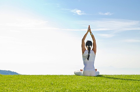 Young woman practising Hatha yoga outdoors, showing the pose merudandasana, sitting mountain pose, Nove Mesto, Okres Teplice, Czech Republic, Europe