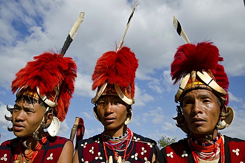 Warriors of the Yimchunger tribe waiting to perform ritual dances at the Hornbill Festival, Kohima, Nagaland, India, Asia