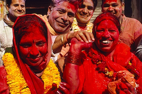 Visitors of the Holi festival, sprayed with colour powder and water, Vrindaban, Uttar Pradesh, India, Asia