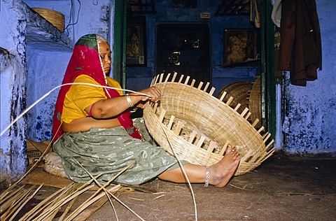 Local woman making basket from bamboo, Jodhpur, Rajasthan, India, Asia