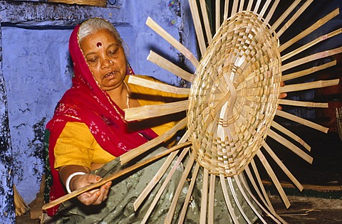 Local woman making basket from bamboo, Jodhpur, Rajasthan, India, Asia