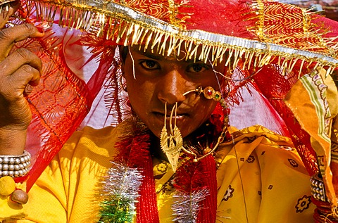 Bride with the typical wedding jewellery during the wedding ceremony, in the village of Gangi, India, Asia