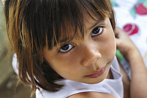 Cute girl looking up, Amazon Basin, Brazil