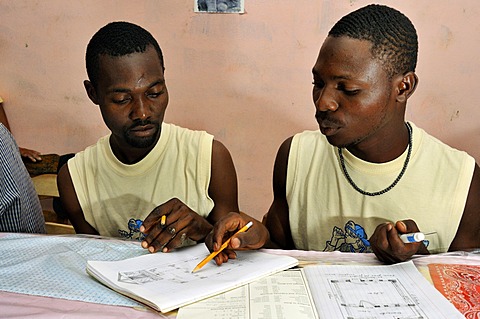 Architecture students drawing a diagram of a earthquake-proof house with truss structure. They are being trained by a German aid organization after the devastating earthquake in January 2010, Coq Chante village near Jacmel, Haiti, Caribbean, Central Ameri