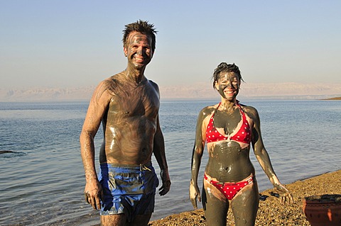 Tourists smeared with salty mud from the Dead Sea, near Suwaymah, Jordan, Middle East, Orient