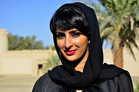 Native woman with veil in the Al-Jahili Fort of Al Ain, Unesco World Heritage Site, Abu Dhabi, United Arab Emirates, Arabian Peninsula, Orient, Asia