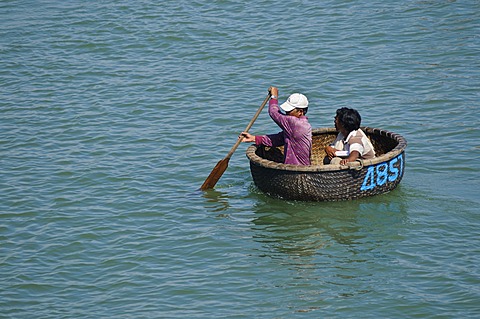 Traditional round wicker boat on the Cai river in the port, Nha Trang, Vietnam, Southeast Asia