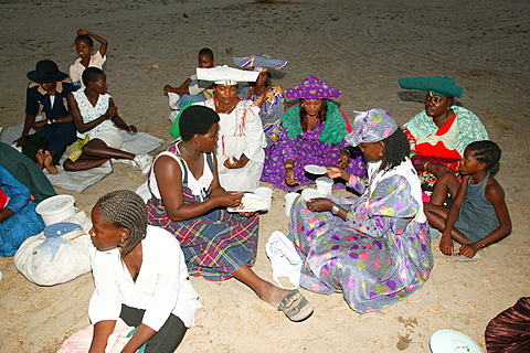 Women of the community gathering under the village tree, Sehitwa, Botswana, Africa