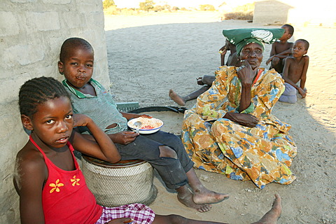 Grandmother with grandchildren, Sehitwa, Botswana, Africa