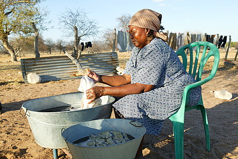 Women washing clothes in the open, Cattlepost Bothatoga, Botswana, Africa