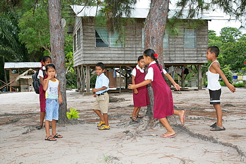 Pupils in uniform during break, Amerindians, tribe of the Arawak, Santa Mission, Guyana, South America