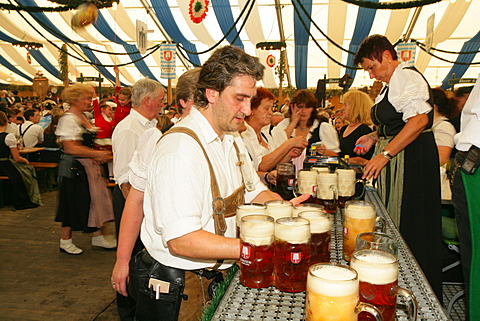 Attendees and wait staff in a beer tent at an international festival for national costume, Muehldorf, Upper Bavaria, Bavaria, Germany, Europe