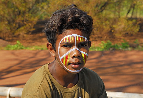 Aboriginal boy posing for tourists, Tiwi Islands, Darwin, Northern Territory, Australia