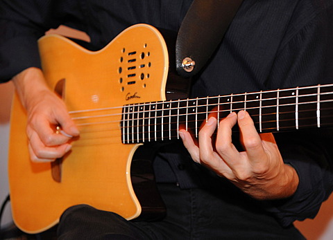 Man playing an electric guitar