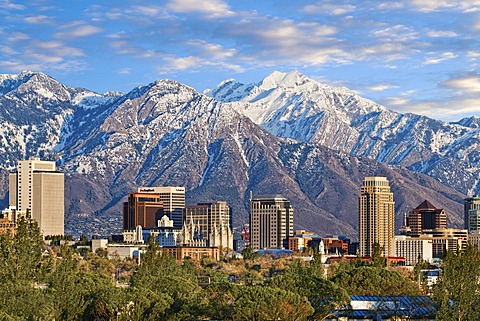 Skyline of downtown Salt Lake City with the towering Wasatch Mountain range at back, Utah, USA