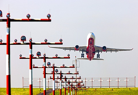 Runway landing lights in front of an Air Berlin Airbus A330 taking off at Duesseldorf International Airport, Duesseldorf, North Rhine-Westphalia, Germany, Europe