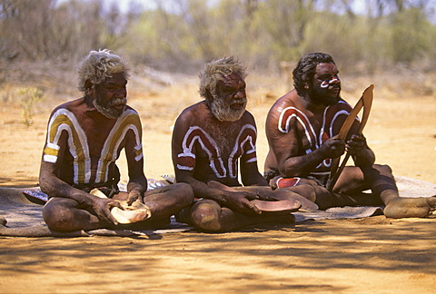 Aborigines, indegenous people of Australia holding boomerangs for hunting, Outback, Northern Territory, Australia