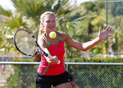 Young woman playing tennis in a holiday club, Manavgat, Turkey