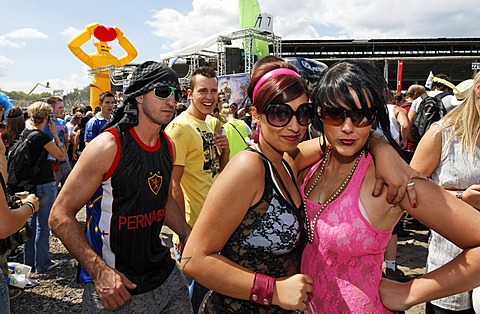 Two young female ravers posing for the camera, Loveparade 2010, Duisburg, North Rhine-Westfalia, Germany, Europe