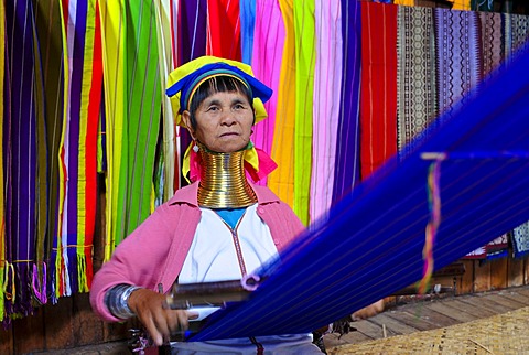 Older long-necked woman of the Karen or Padaung tribe weaving a carpet, Inle Lake, Myanmar, Burma, Southeast Asia, Asia