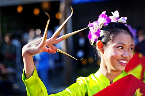 Young female dancer at a street parade in Chiang Mai, Thailand, Asia