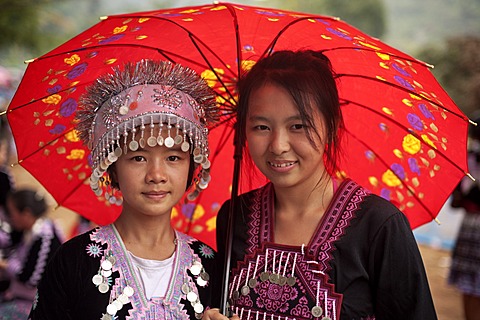 Two traditionally dressed Hmong women at a new year festival at Hung Saew village, Chiang Mai, Thailand, Asia