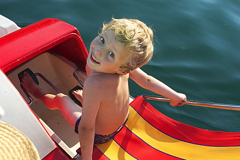 5 year old boy on pedal boat - Lake Wolfgang - Salzburger Land - Salzkammergut - Austria