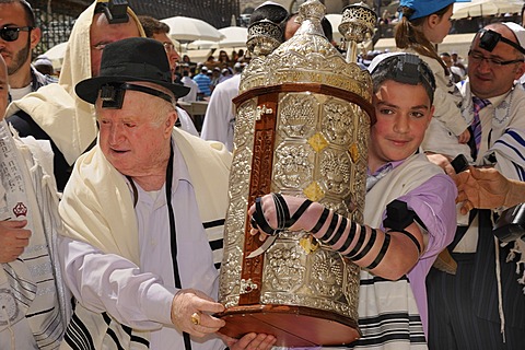 Bar Mitzvah celebration at the Western or Wailing Wall in the direction of the Jewish Quarter, boy is carrying the Torah scroll with the help of his father, Muslim Quarter, Old City, Jerusalem, Israel, Middle East