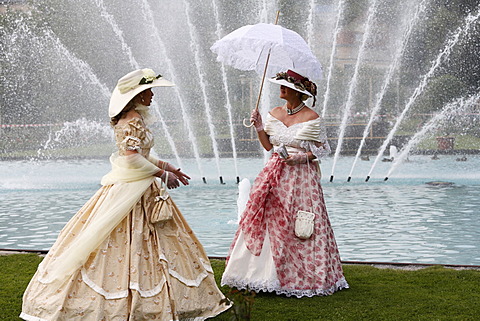 Two women wearing historical costumes in front of a fountain, RÃ¡kÃ³czi-Fest festival, Bad Kissingen, Rhoen, Lower Franconia, Bavaria, Germany, Europe