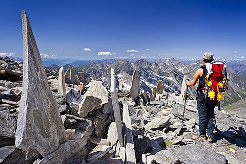 Climber descending from Mt. Hochfeiler, Pfitschtal valley, in the back the Pfitschtal and Wipptal valleys, South Tyrol, Italy, Europe