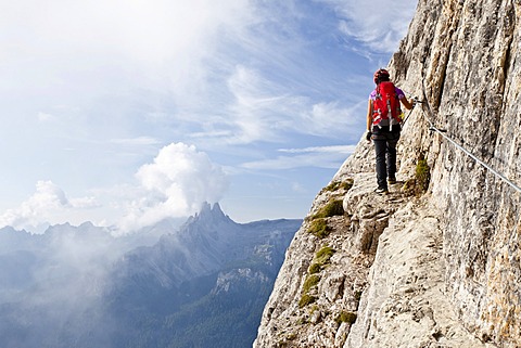 Climber on the Via Ferrata Giuseppe di Olivieri, Dolomites, Belluno, Italy