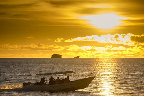 Diving boats with tourists in the evening light, Palau, Micronesia