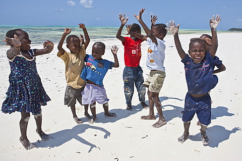 Children playing on the beach, Zanzibar, Tanzania, Africa