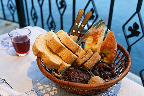 Typical bread basket with olives, Crete, Greece