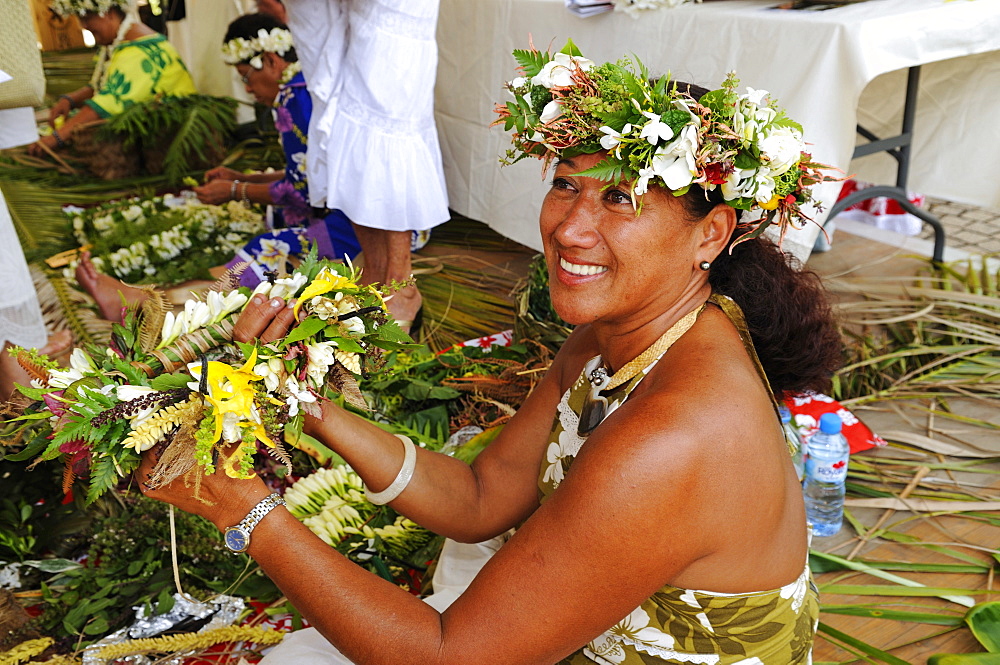 Tahitian woman at a lei, floral garland binding competition, Papeete, Tahiti, Society Islands, French Polynesia, Pacific Ocean