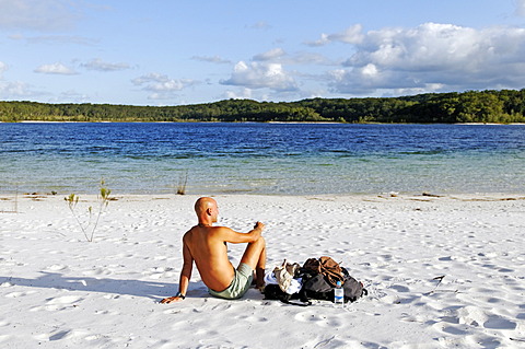 Man on the beach at Lake McKenzie, Fraser Island, Queensland, Australia