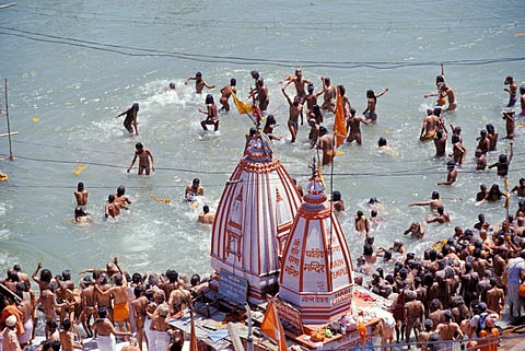 Naked Naga-Sadhus taking a holy bath during the Kumbha or Kumbh Mela in the Ganges River, Har Ki Pauri-Ghat, a famous bathing ghat at Haridwar or Hardwar, Uttarakhand, formerly Uttaranchal, North India, India, Asia