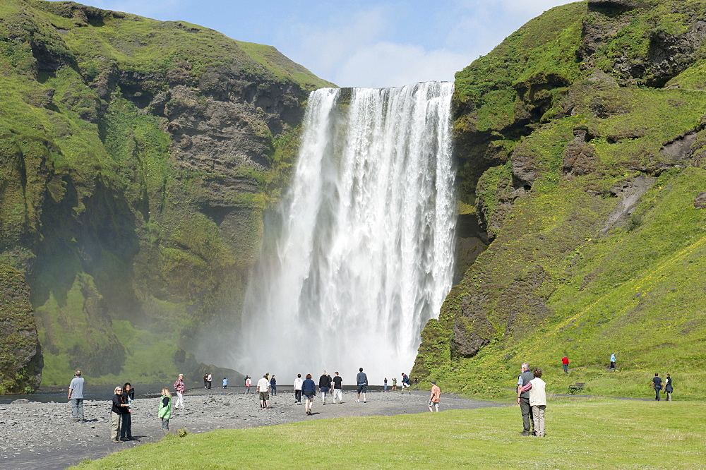 Large waterfall Skogafoss with tourists, Skogar, Iceland, Scandinavia, Northern Europe, Europe