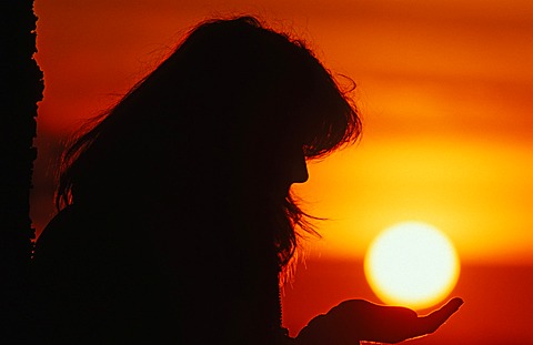 Silhouette of a woman, sunset