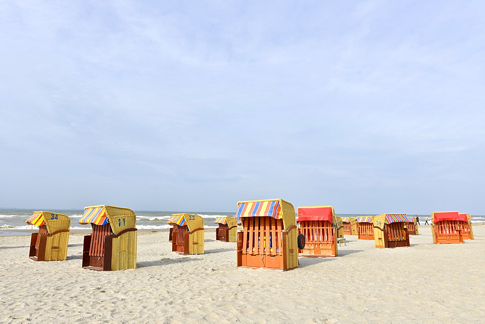 Roofed wicker beach chairs on the beach of Niendorf, Baltic Sea, Schleswig-Holstein, Germany, Europe