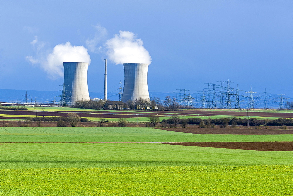 Grafenrheinfeld nuclear power plant, steam coming out of the cooling towers against a dark sky, Grafenrheinfeld, Bavaria, Germany, Europe