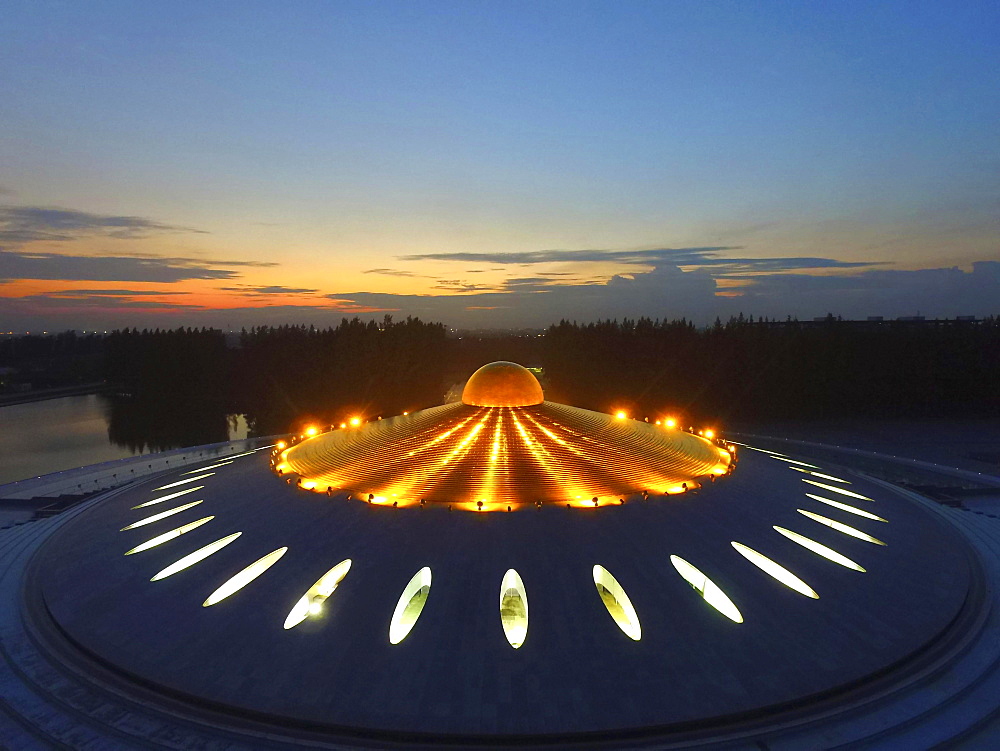 Phra Mongkol Thepmuni Memorial Hall, illuminated golden dome of the Phramonkolthepmuni meditation hall, Khlong Luang District, Pathum Thani, Bangkok, Thailand, Asia (Drone)