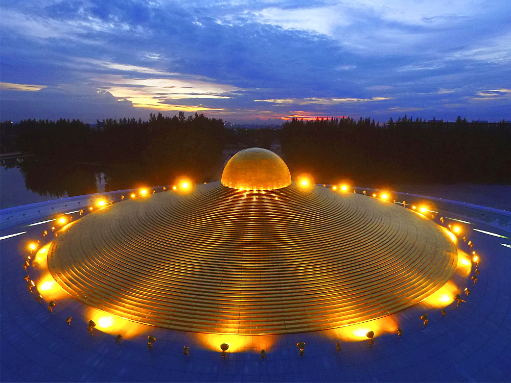 Phra Mongkol Thepmuni Memorial Hall, illuminated golden dome of the Phramonkolthepmuni meditation hall, Khlong Luang District, Pathum Thani, Bangkok, Thailand, Asia (Drone)