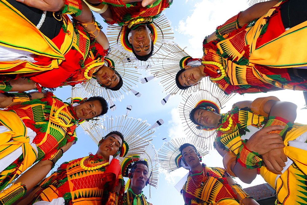 Nagaland tribesmen looking down with heads in a circle, Kisima Nagaland Hornbill festival, Kohima, Nagaland, India, Asia