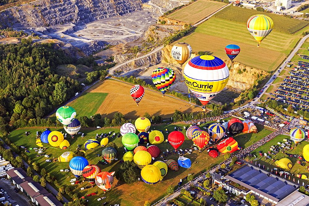 Different colored hot air balloons rising into the air, hot air balloon festival, 26th international Warsteiner Montgolfiade, Warstein, Sauerland, North Rhine-Westphalia, Germany, Europe