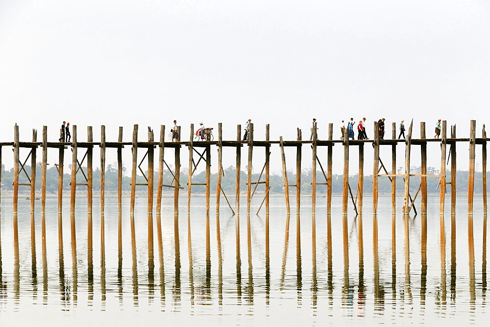 People crossing U Bein bridge, Taungthaman Lake, Mandalay region, Myanmar, Asia