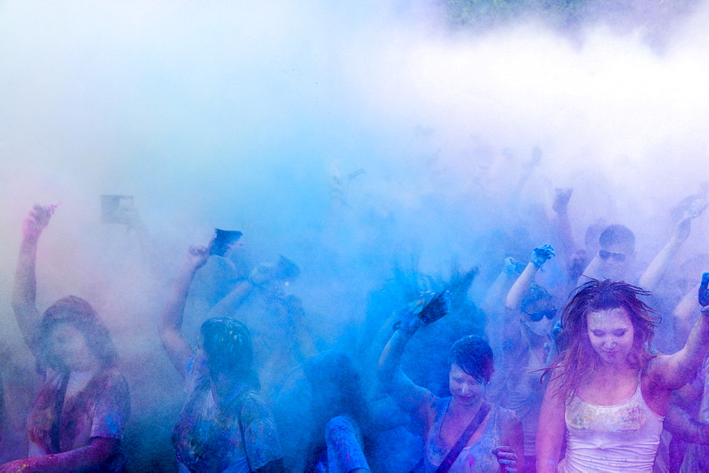 Thousands of young women and man are throwing color powder in the air at the colorful Holi festival, Dresden, Saxony, Germany, Europe