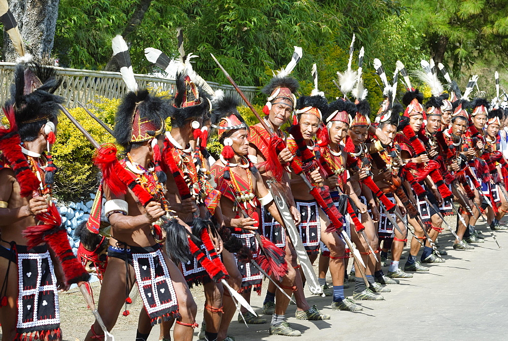 Naga tribal group performers standing in line to welcome Officials at the Hornbill Festival, Kohima, Nagaland, India, Asia