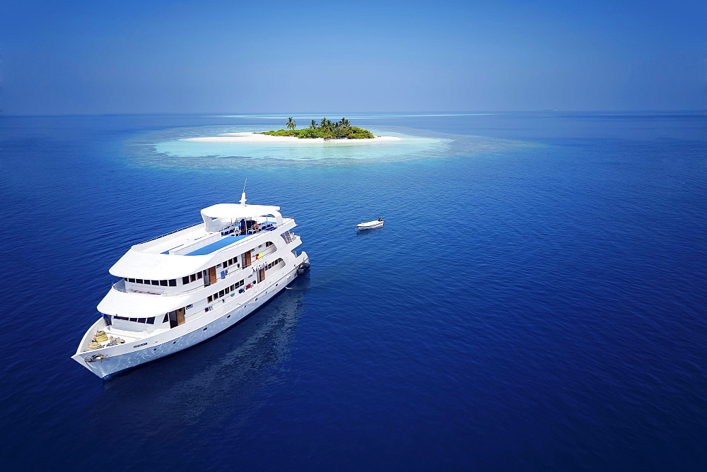 Diving safari ship MS Keana off an uninhabited palm island, Ari Atoll, Indian Ocean, Maldives, Asia