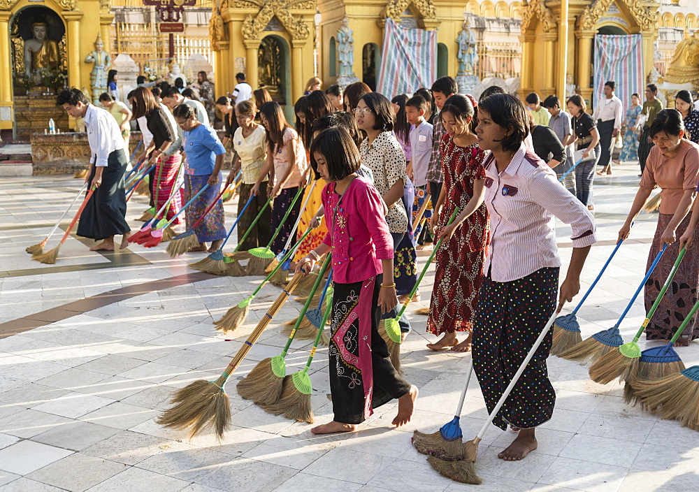 Burmese women sweeping the floor of the Shwedagon Pagoda, Yangon, Rangoon, Myanmar, Asia